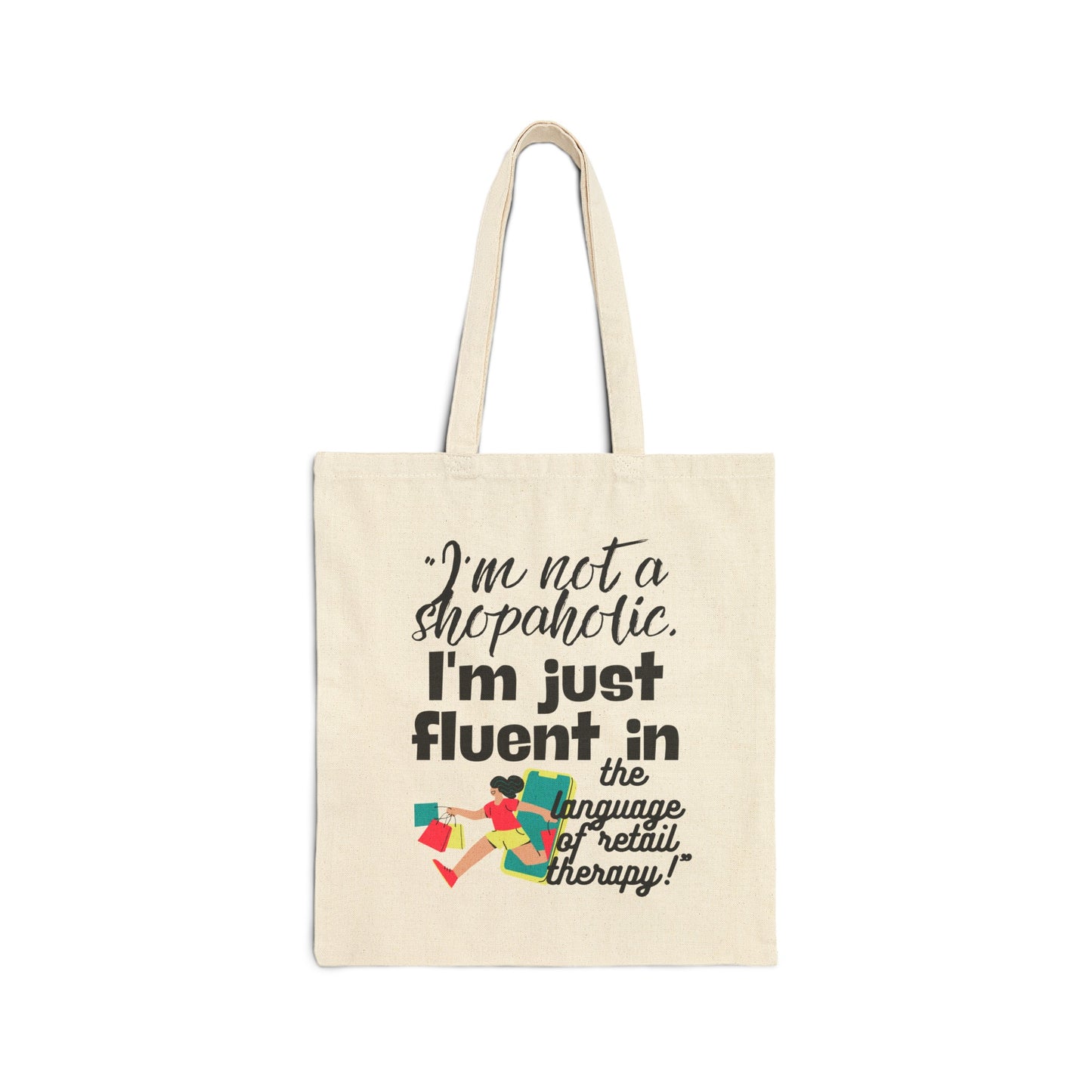 "I'm not a shopaholic; I'm just fluent in the language of retail therapy!"- Cotton Canvas Tote Bag