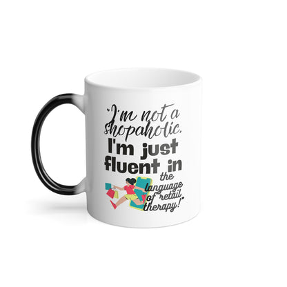 "I'm not a shopaholic; I'm just fluent in the language of retail therapy!" - Color Morphing Mug, 11oz